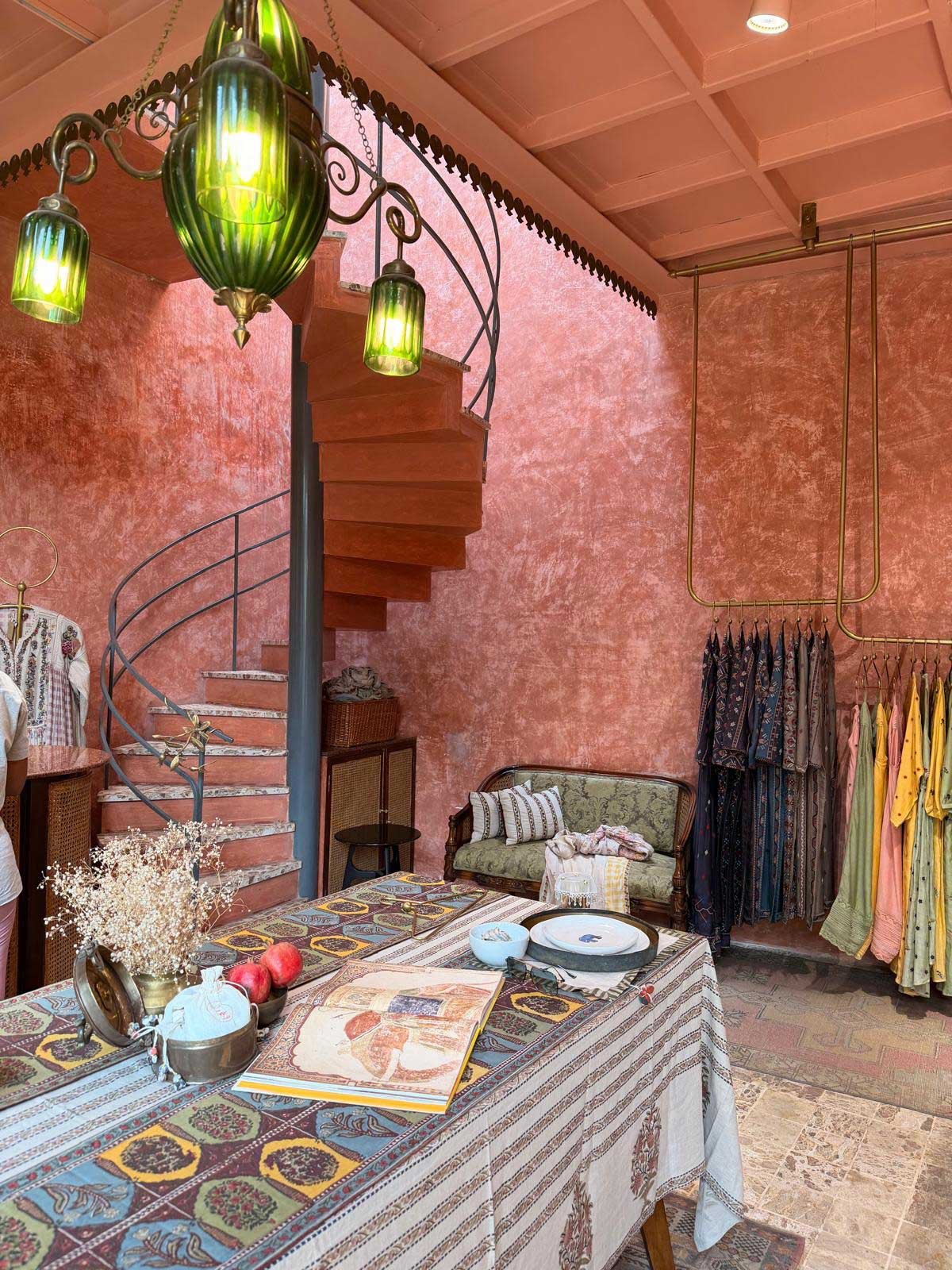 A shop and staircase on a Curious James journey in India